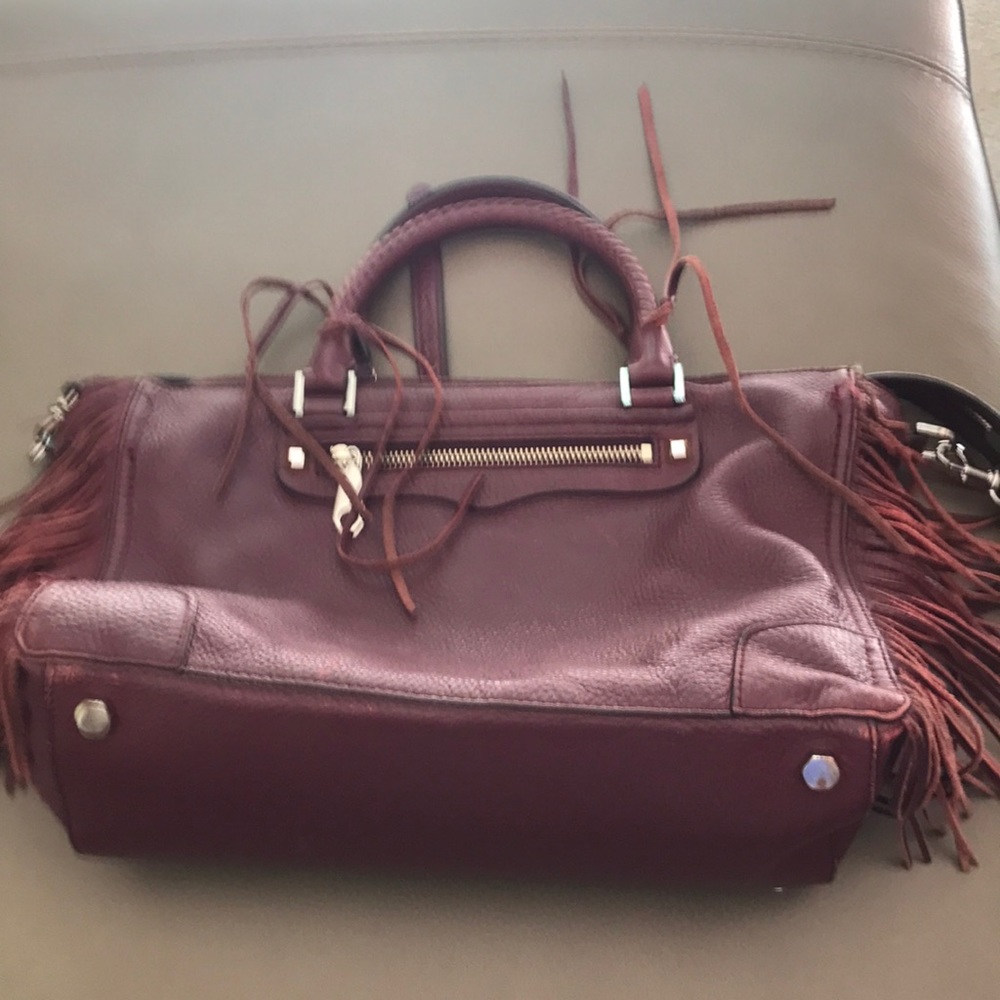 Well-worn Rebecca Minkoff burgundy bag w/fringe 12 1/2 X 9inches 6”bottom depth